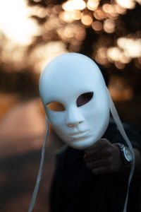 focus photography of white mask